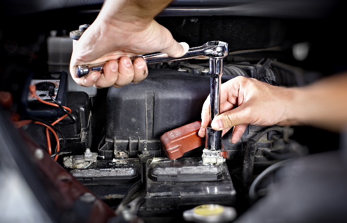 Mechanic carrying out vehicle servicing at LS Motors